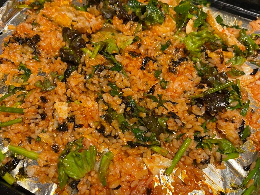 Bright red fried rice paired with vibrant green minari, A perfect color combo and totally appetizing.