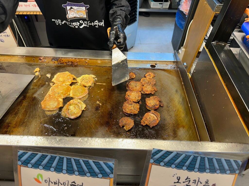 yellow squid sundae coated in an egg, crispy grilled squid sindae