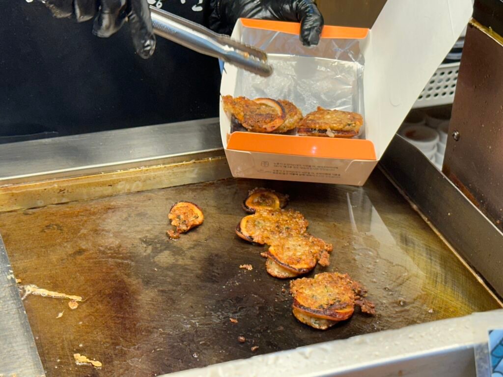 Squid sundae being packed for takeout