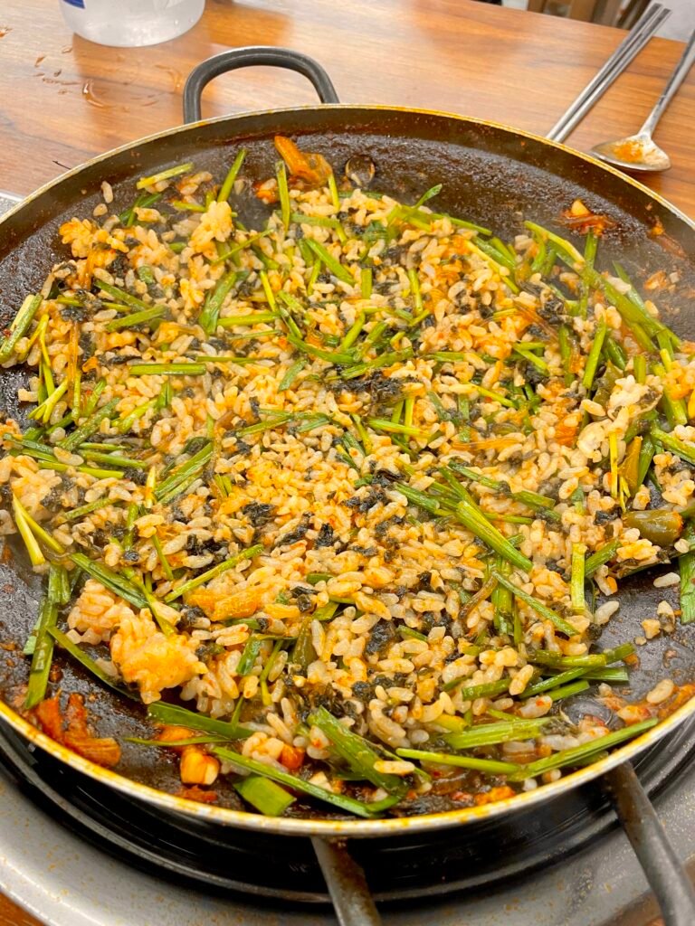 Fried rice being cooked in a large pot