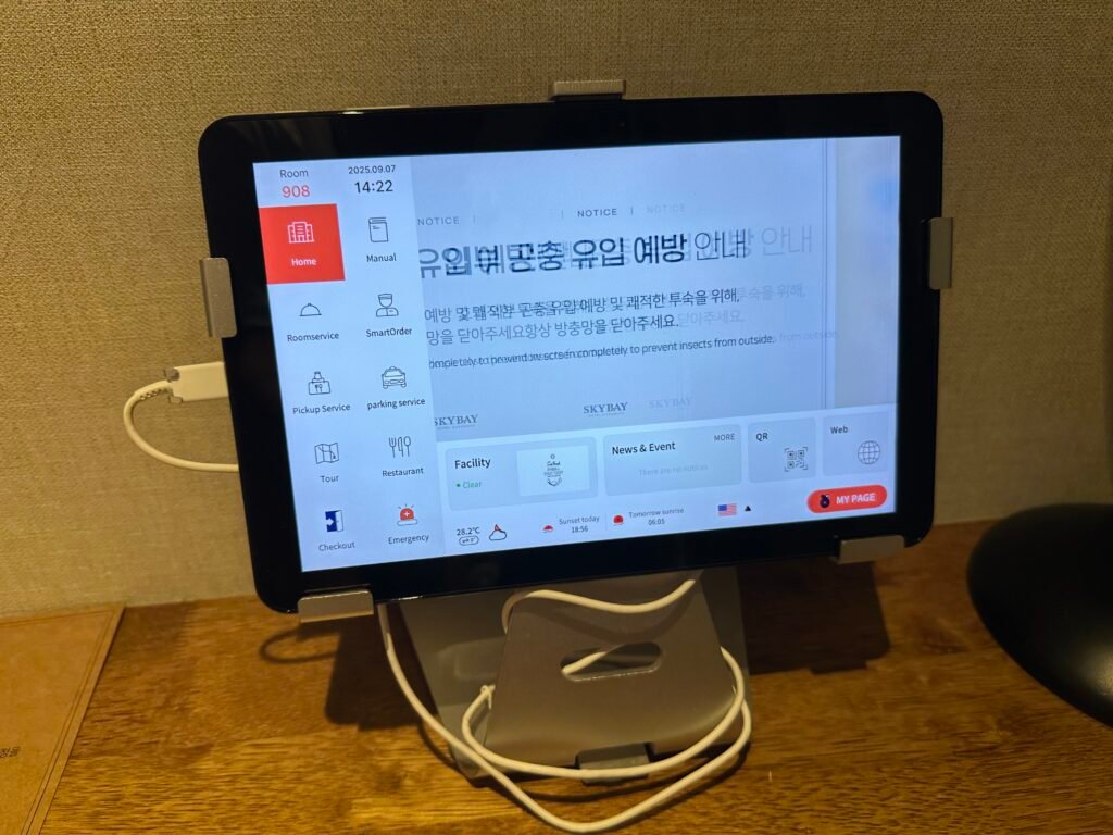 A tablet with hotel information placed on the desk